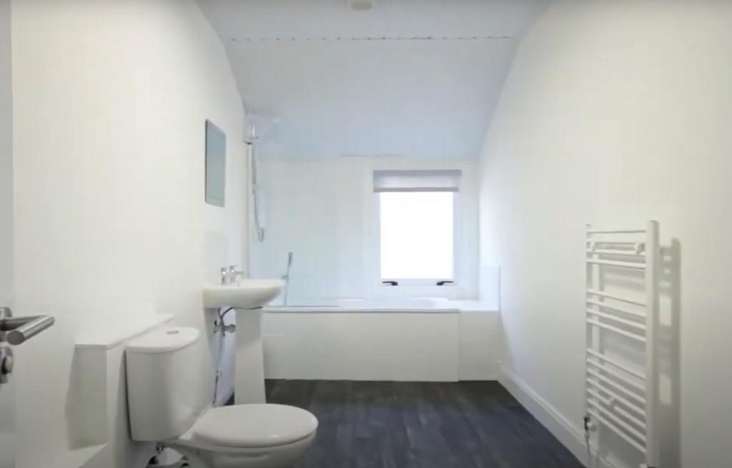 Bright and clean bathroom featuring a full bath...