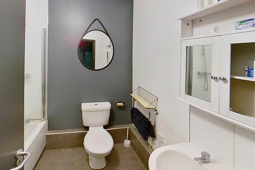 This modern bathroom features a sleek design wi...