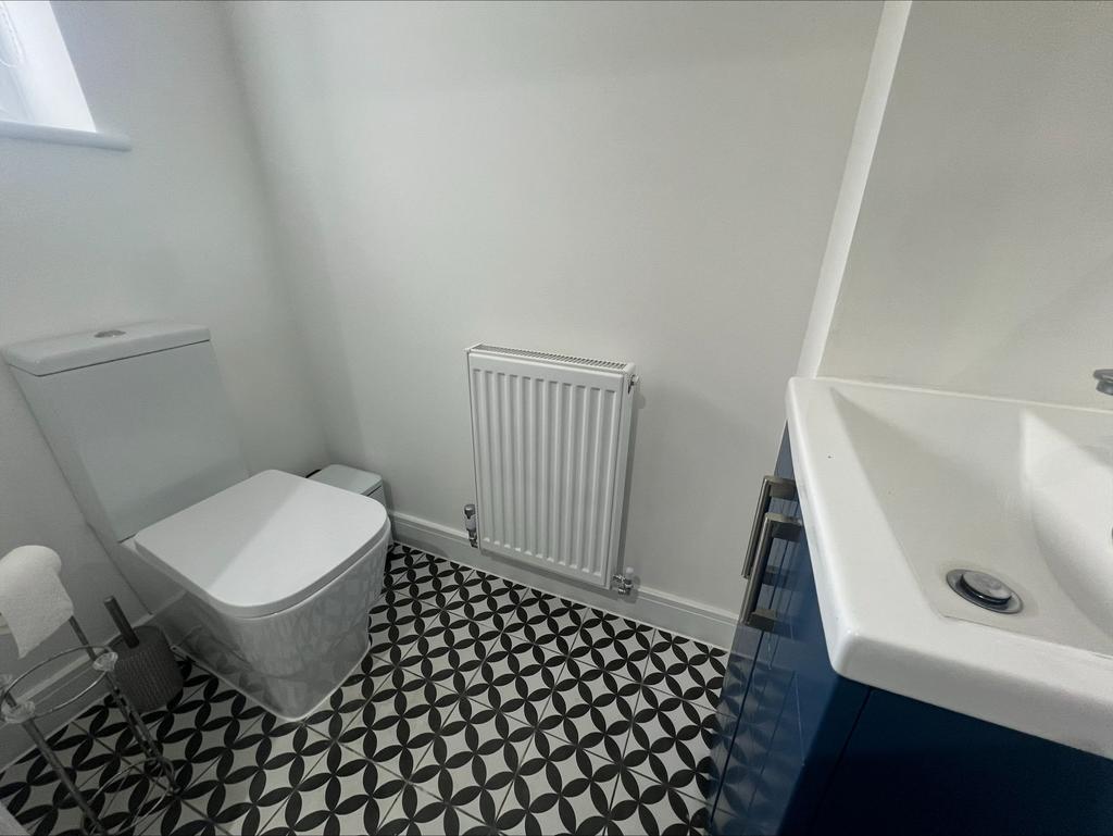 A modern and clean single toilet room featuring...