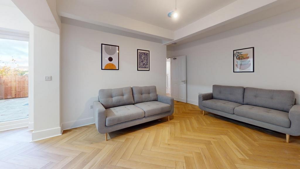 A spacious and inviting modern living room with...