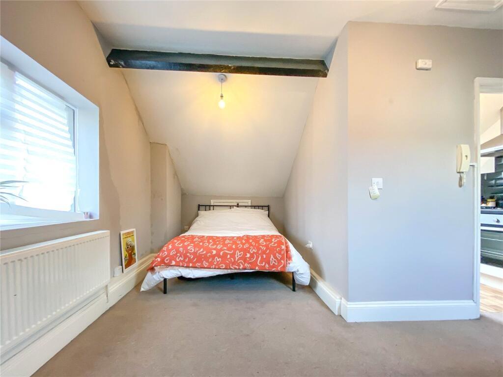 A cozy double bedroom featuring a comfortable d...