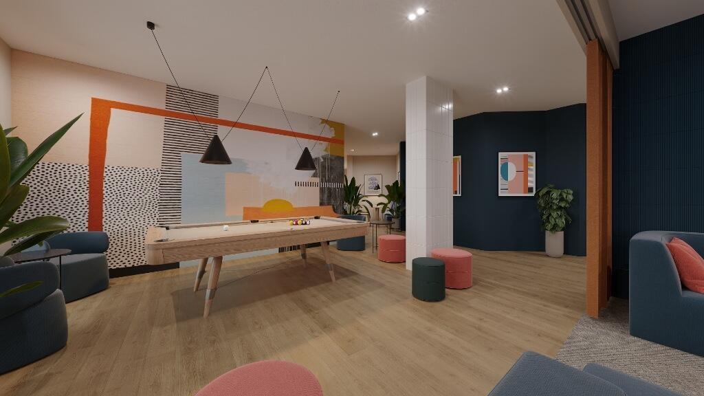 A modern communal lounge featuring a stylish po...