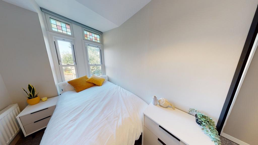 A bright and inviting double bedroom, perfect f...