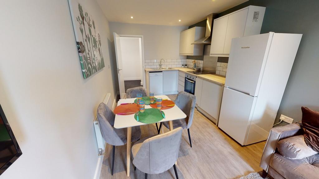 A bright and inviting kitchenette with modern a...