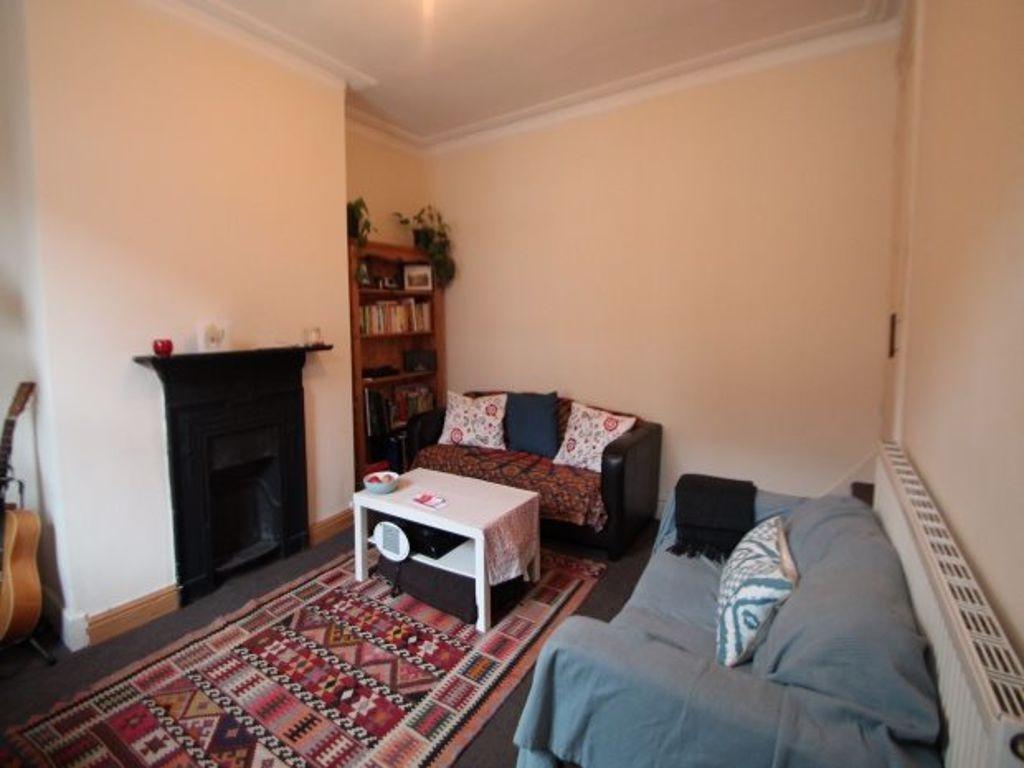 Cozy living room featuring comfortable seating,...
