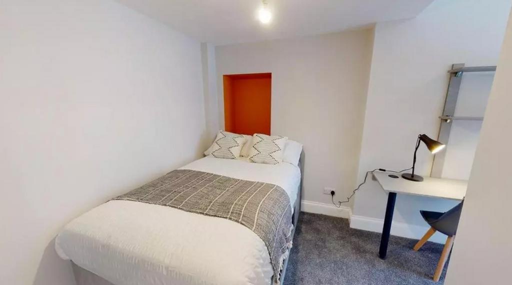 A cozy and well-lit double bedroom featuring a ...