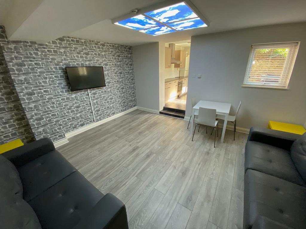 A spacious and inviting large modern living roo...