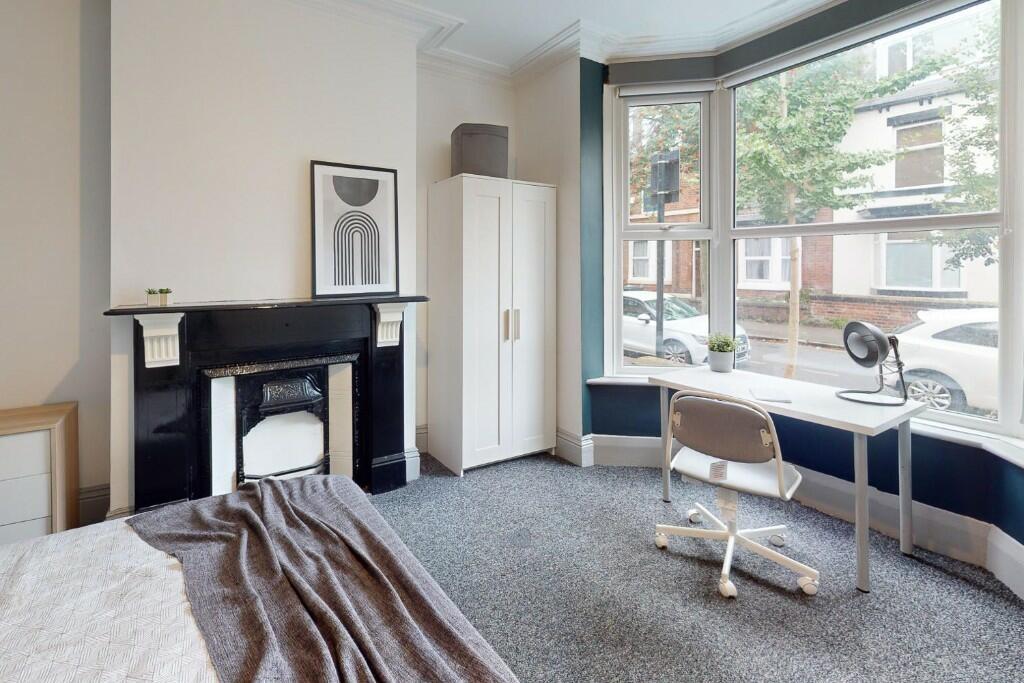 Bright and spacious master bedroom featuring a ...