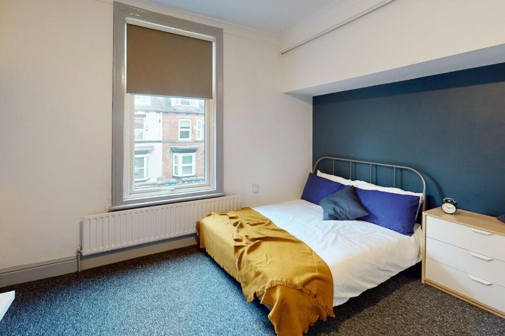 Bright and cozy bedroom with a comfortable sing...