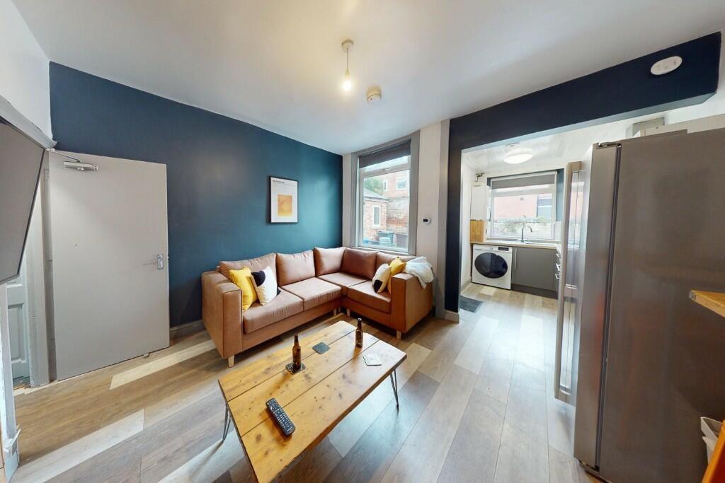 A modern living room featuring a comfortable L-...
