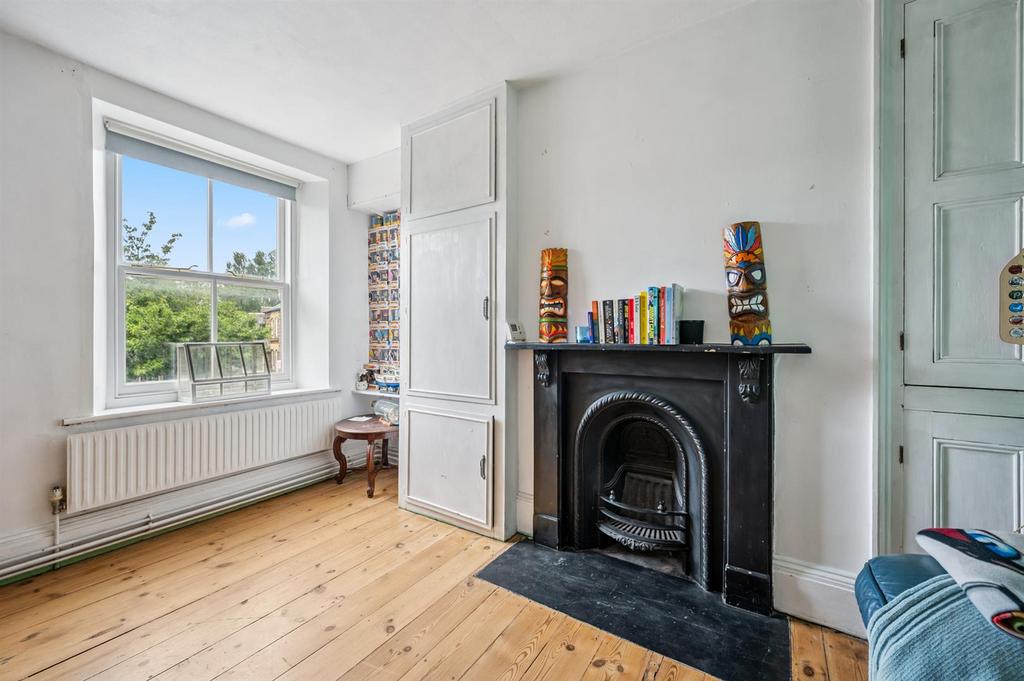 Bedroom One - fireplace and window.jpg
