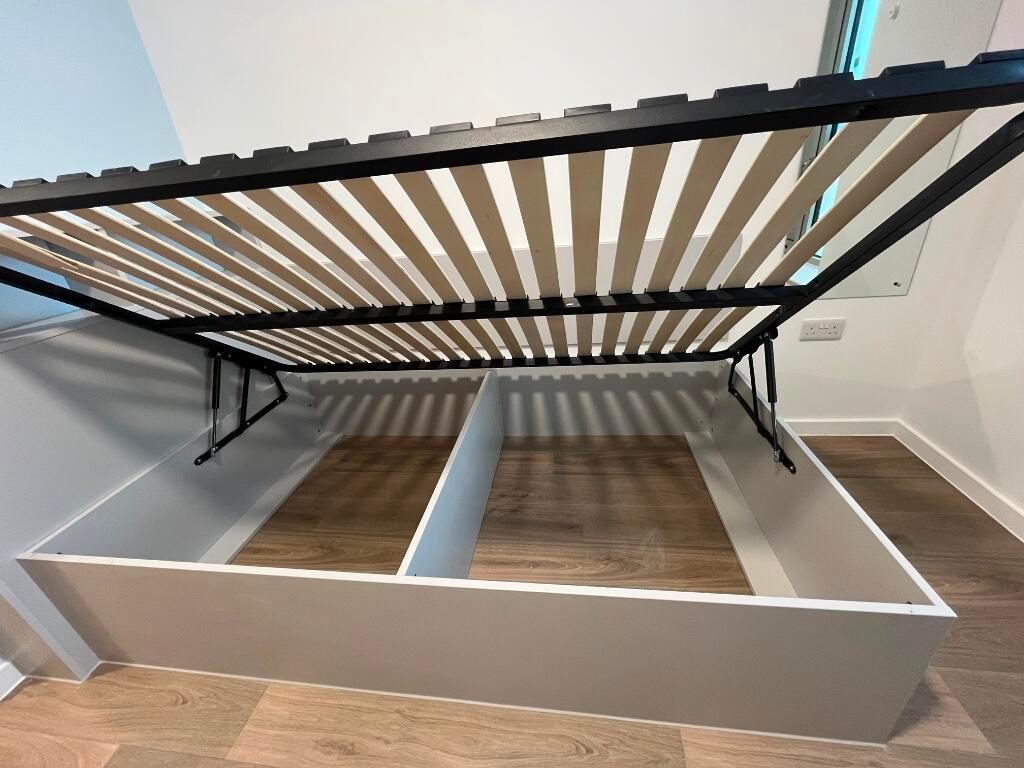 A compact, clean single toilet room with modern...