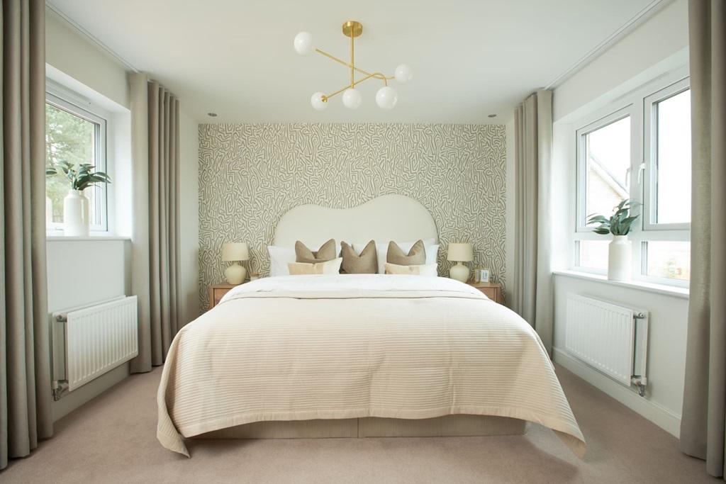 The king-size main bedroom has ample storage space