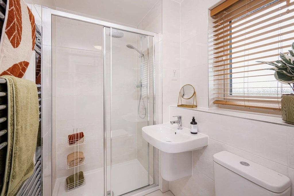 Bedroom 1 also hosts a private en suite shower...
