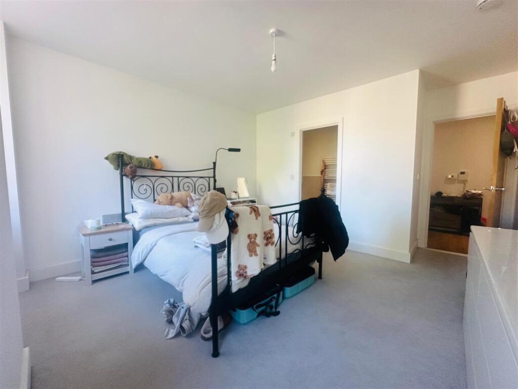Bright and inviting master bedroom featuring a ...