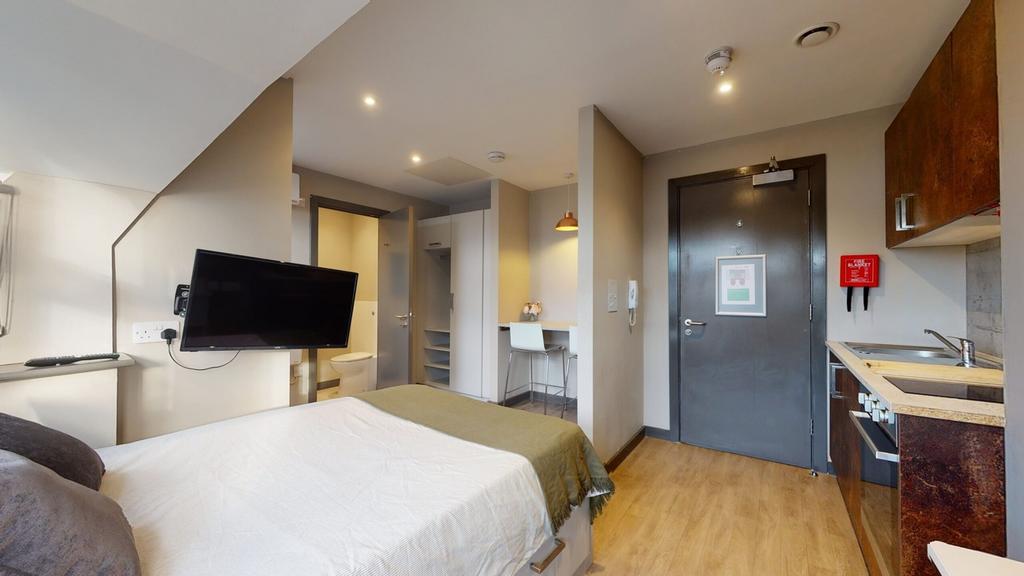 A bright and modern double bedroom featuring a ...