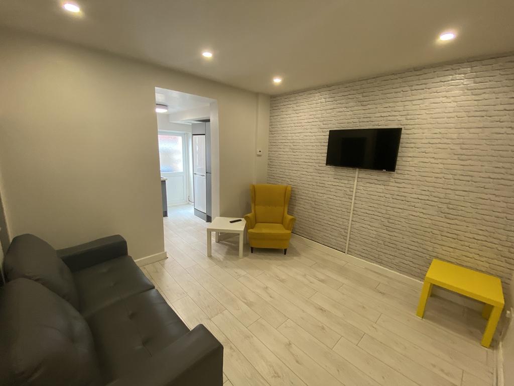A modern living room featuring a cozy seating a...