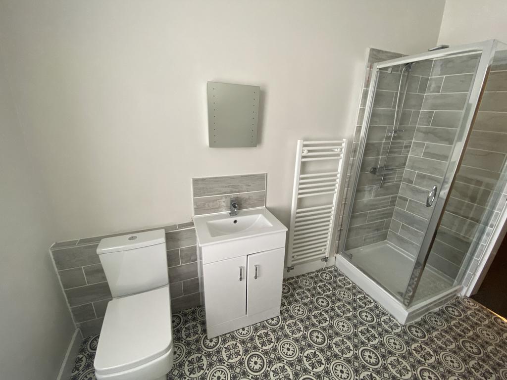 This modern bathroom features a sleek design wi...