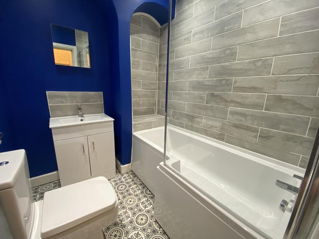 Stylish bathroom suite featuring a modern bath,...