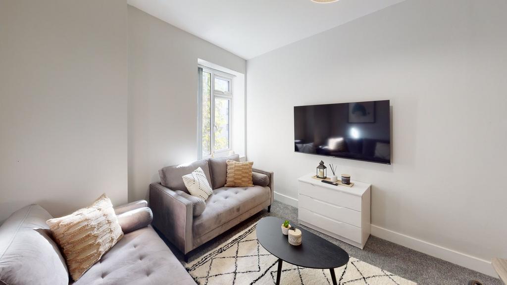 A bright and inviting living room with modern d...
