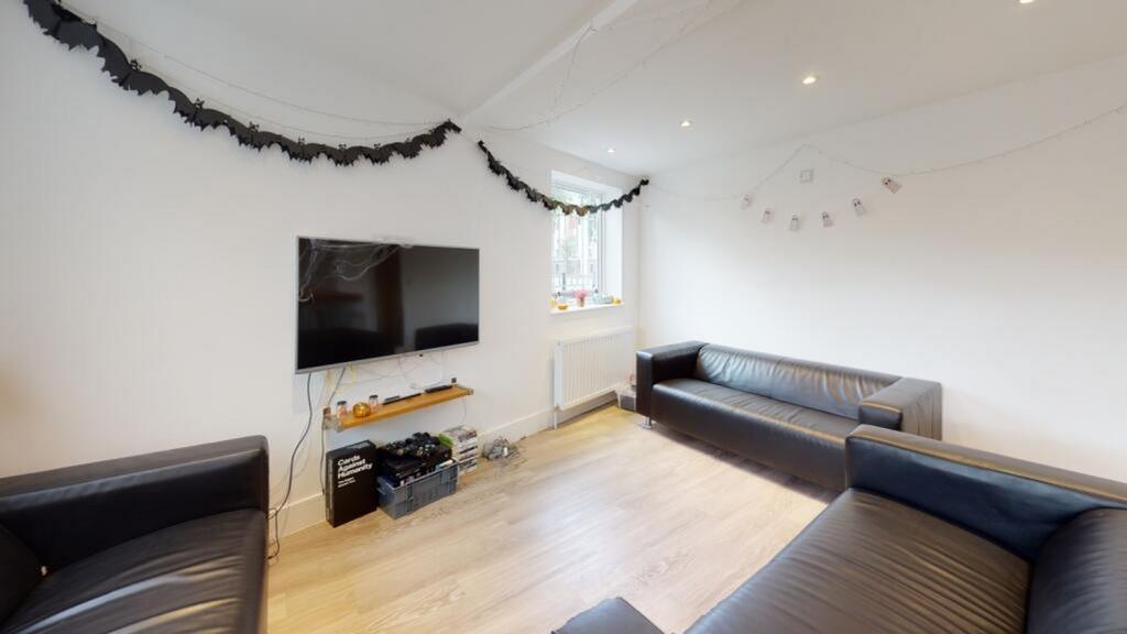 A stylish and modern living room featuring comf...