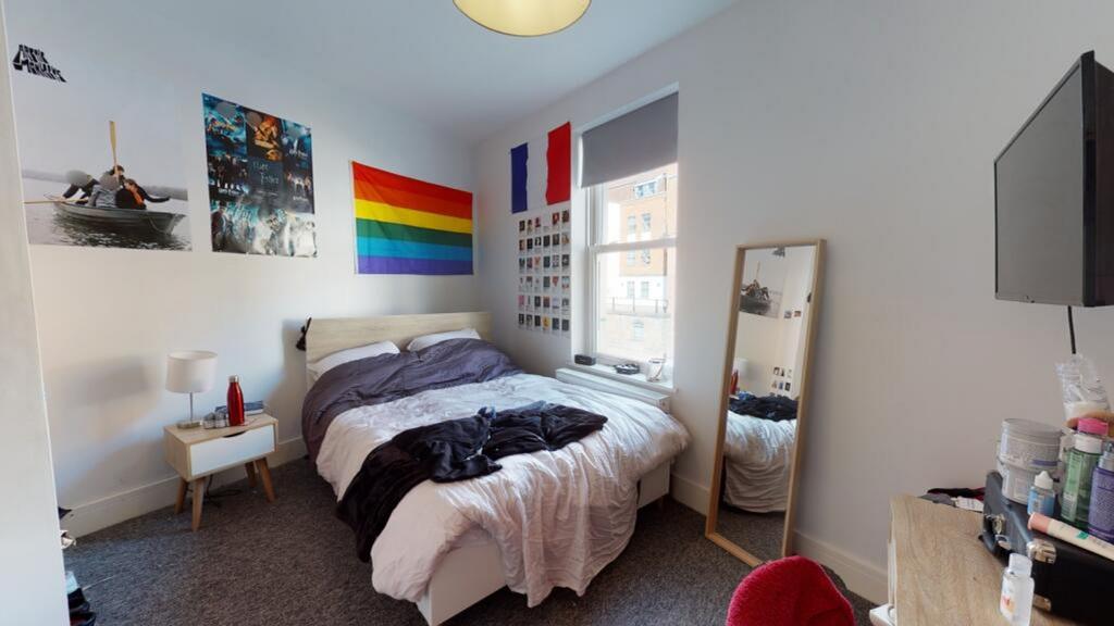 A cozy and stylish double bedroom featuring a c...