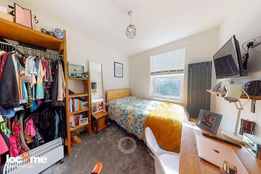 A bright and inviting double bedroom featuring ...