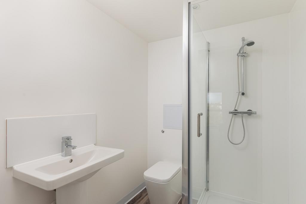 A modern and clean bathroom featuring a shower ...