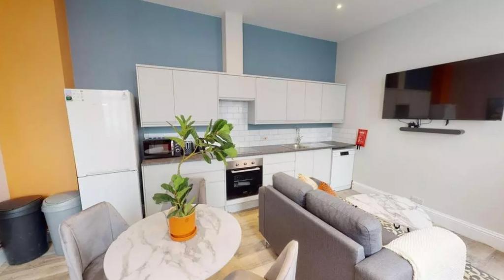 A modern and spacious kitchenette with ample st...