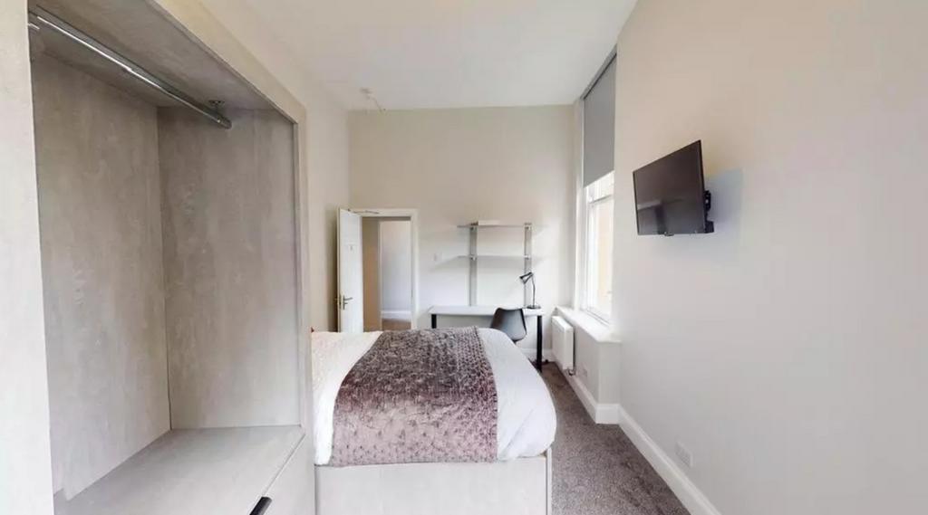 A bright and inviting double bedroom featuring ...