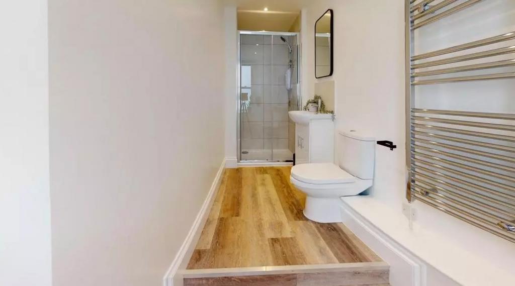 A modern and clean bathroom featuring a shower ...