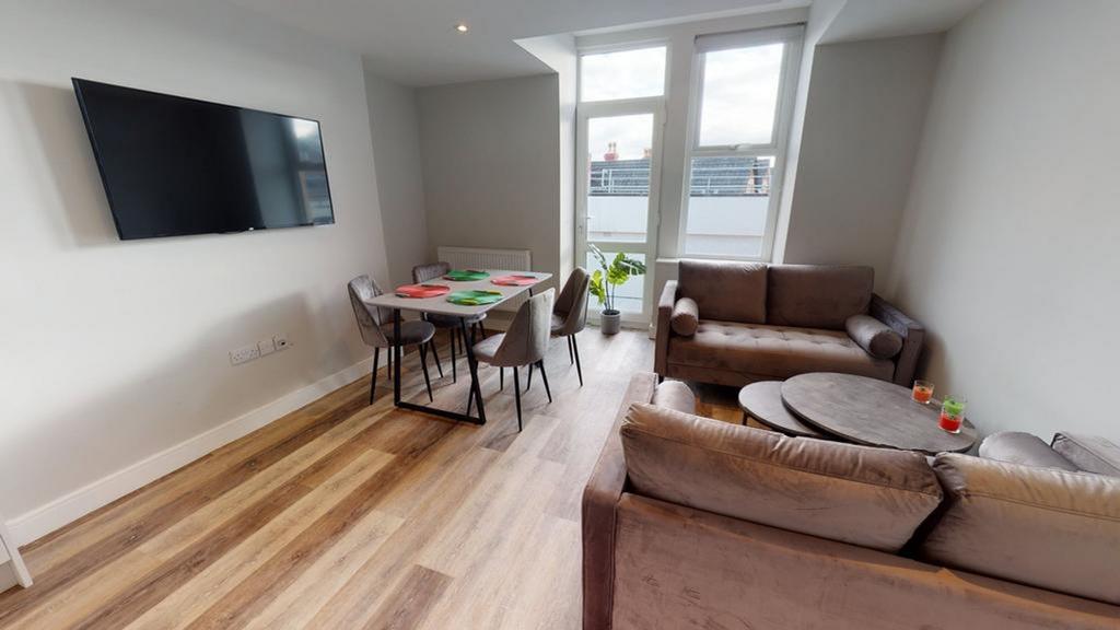 A spacious and well-lit modern living room perf...