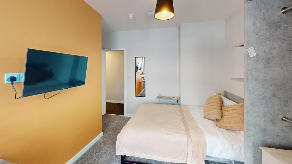 A stylish and cozy double bedroom featuring mod...