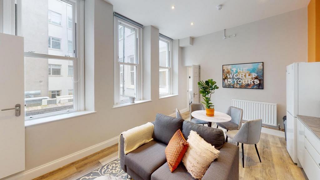 A bright and spacious modern living room, perfe...