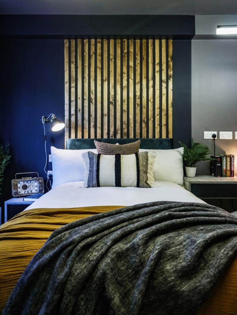 A stylish and cozy double bedroom featuring a n...