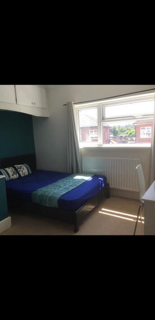 Bright and inviting double bedroom featuring a ...