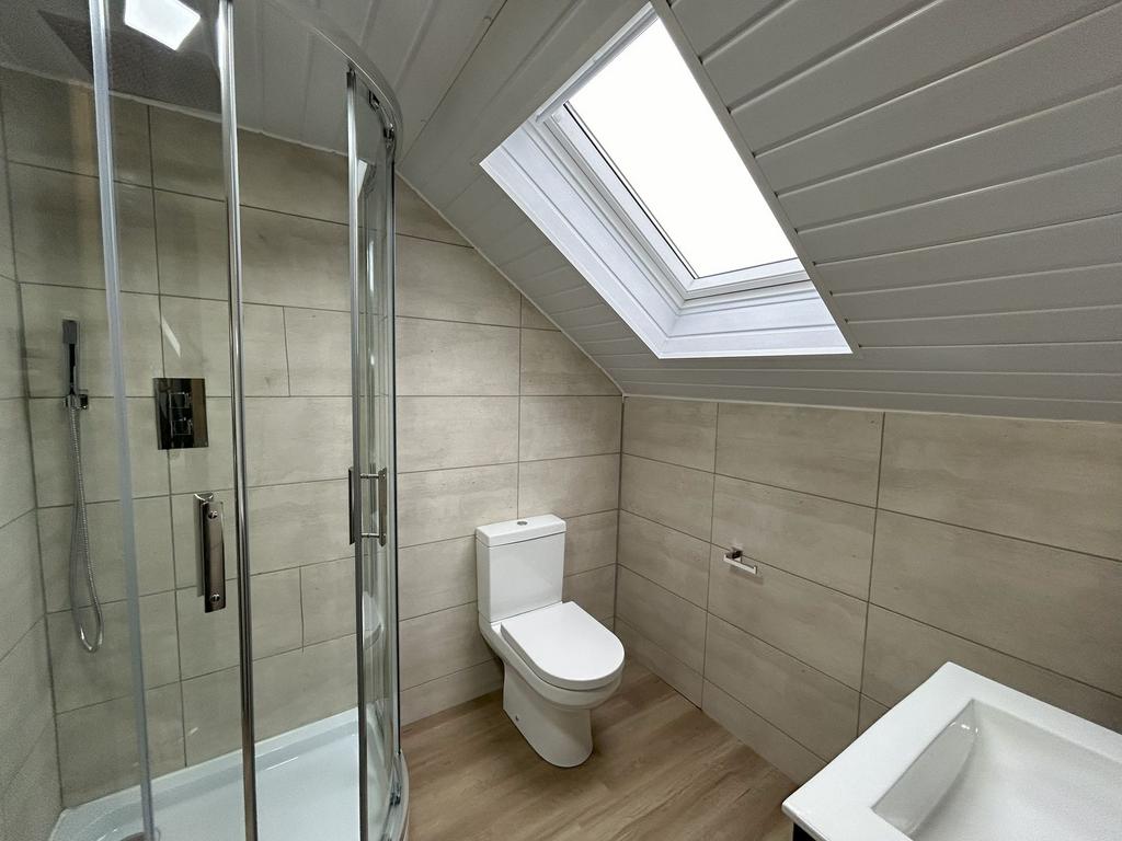 Modern bathroom with a spacious shower enclosur...