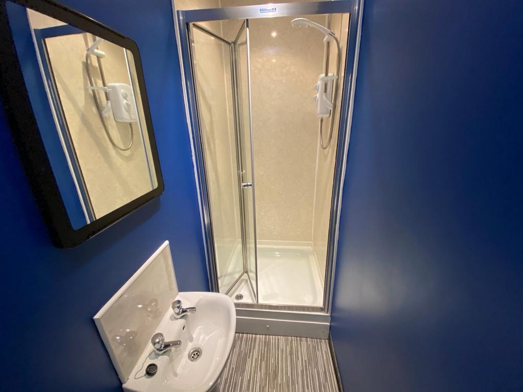 A modern and clean bathroom featuring a spaciou...