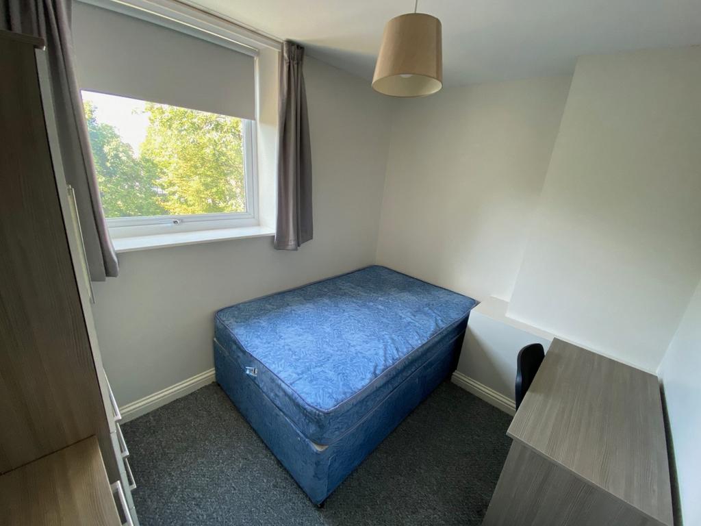 A bright and tidy double bedroom with ample nat...