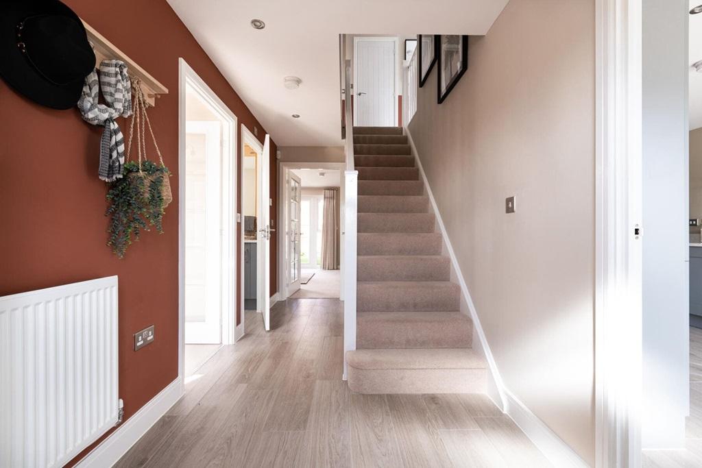 The central entrance hall features a useful...