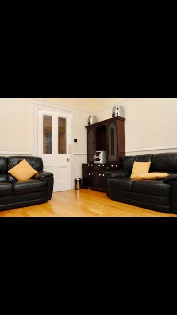 A warm and inviting living room featuring comfo...