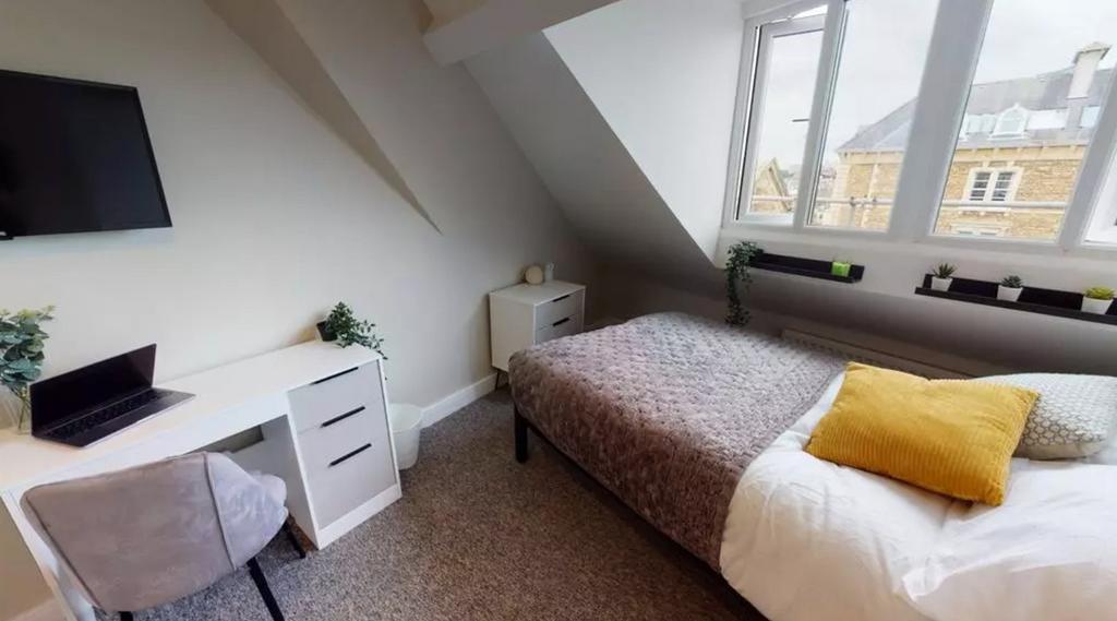 A bright and stylish double bedroom featuring m...
