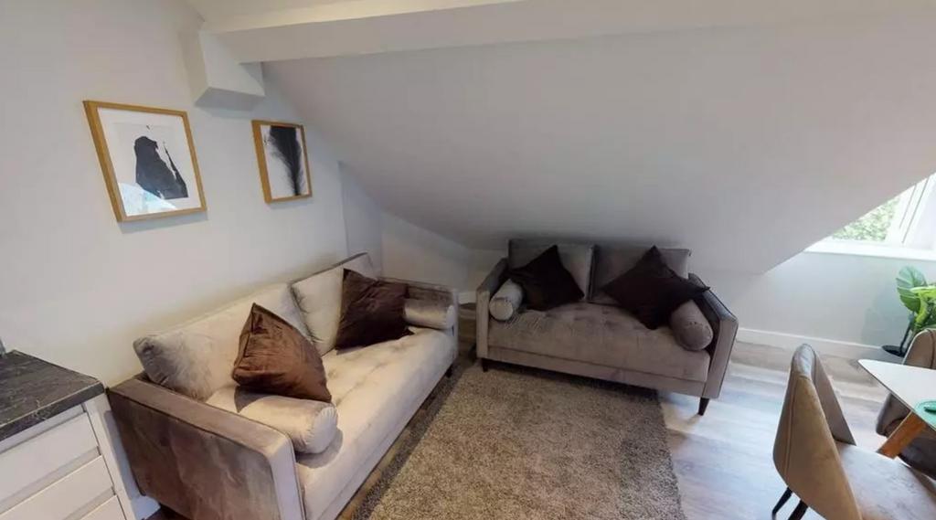A cozy and inviting living room featuring comfo...