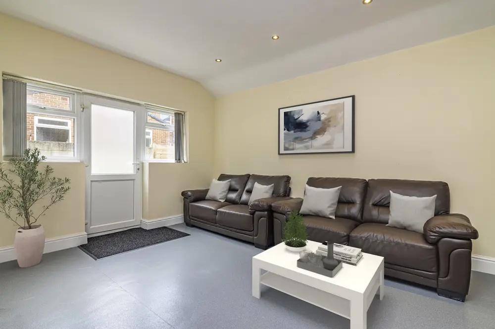 A neat and welcoming living room featuring two ...