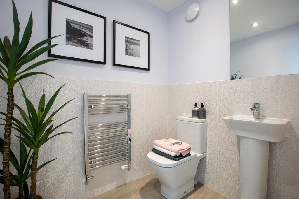 A convenient downstairs toilet is located off...