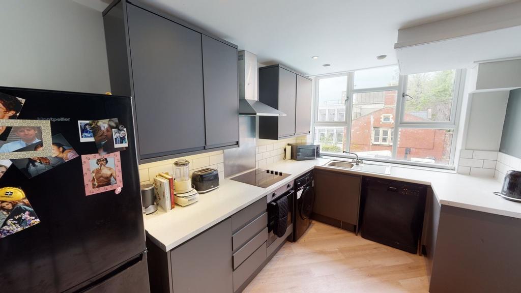 A modern and well-equipped kitchenette with amp...