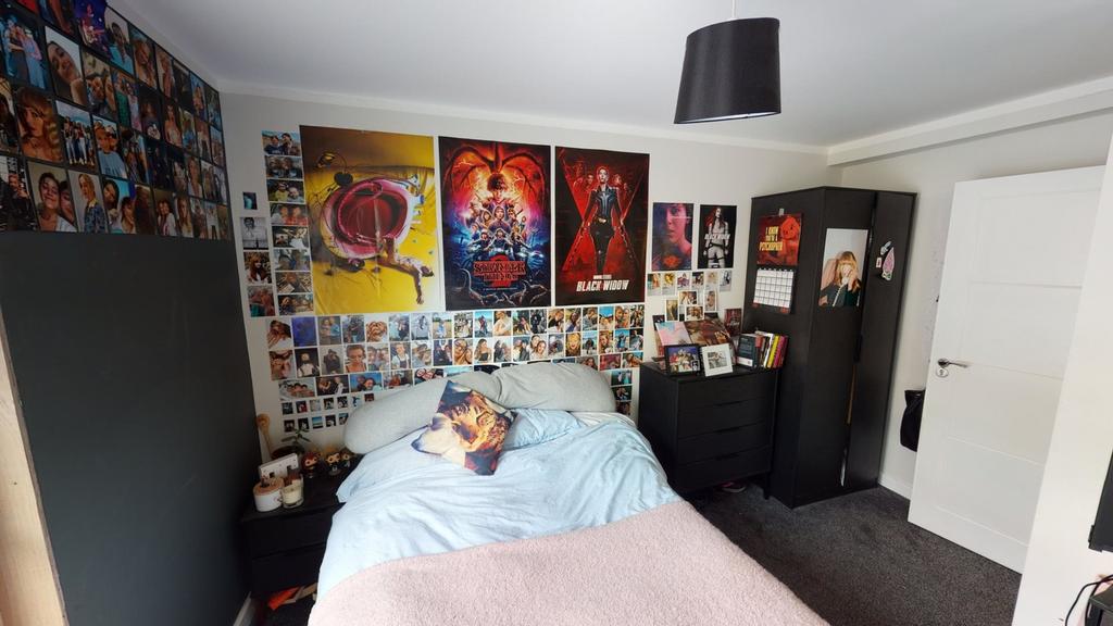 A cozy double bedroom featuring vibrant decor a...