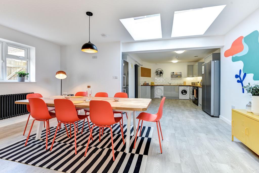 Bright and modern kitchen featuring a spacious ...