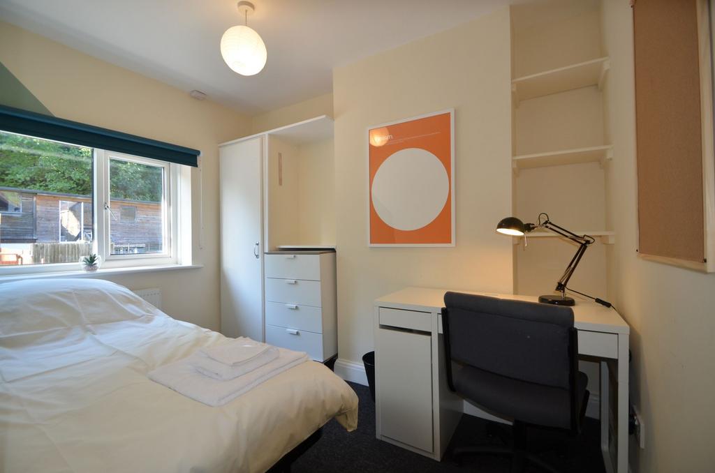 This inviting double bedroom features a cozy la...