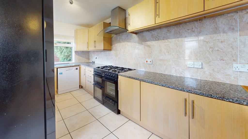 A spacious and bright kitchen featuring modern ...